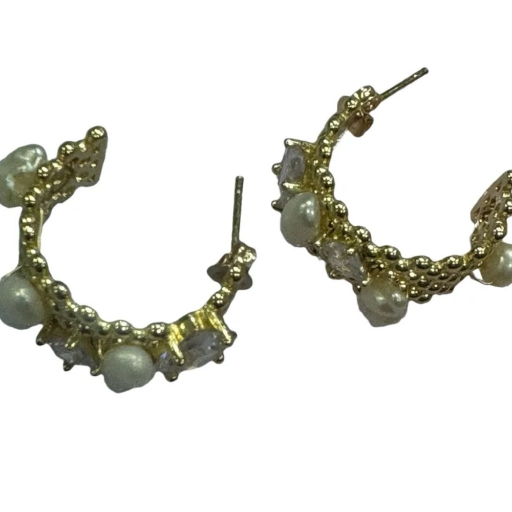 Chunky gold hoop earrings adorned with freshwater pearls
